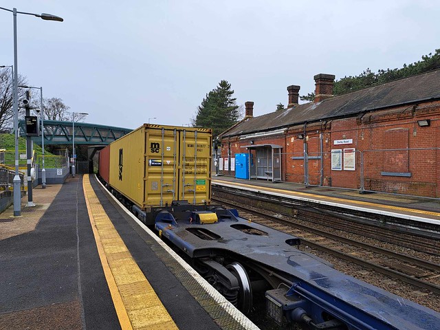 An intermodal train is waiting in platform 1 at Derby Road Station.