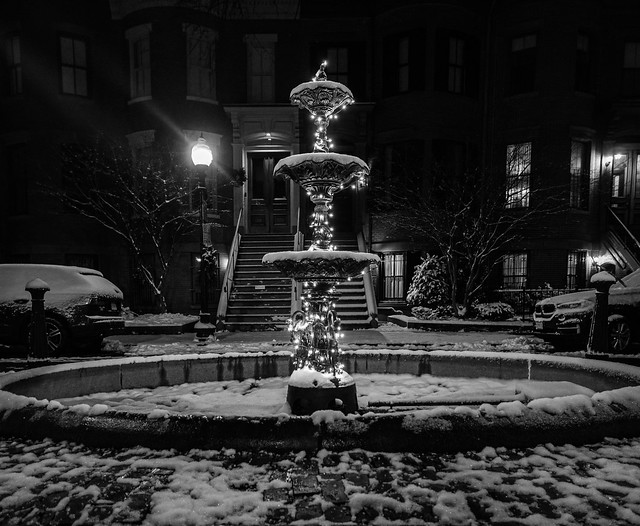 Slight, Sloppy Snow Doesn't Dampen the Lit Fountain