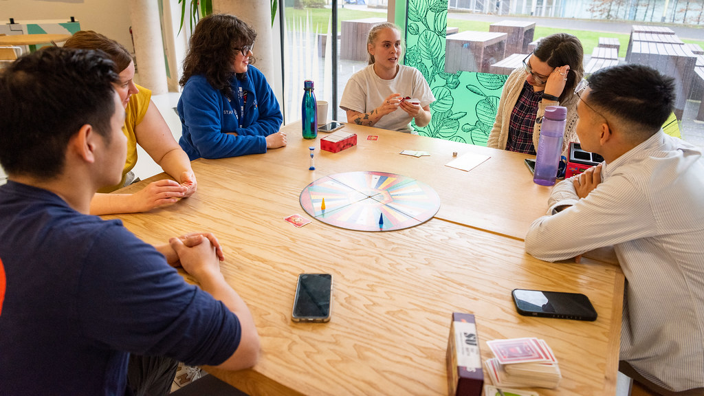 Group of students playing a board game