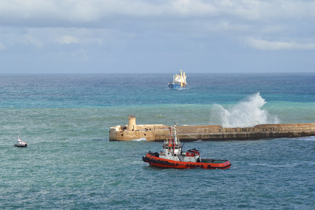 Tug boat LIENI waiting to escort the merchant ship CONSOUTH into Valletta grand harbour during heavy seas.NikonD3100. DSC_0054.