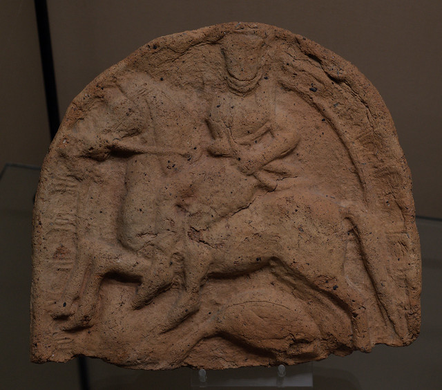 Etruscan terracotta antefix with relief of Artemis riding sidesaddle above a goose, from Capua