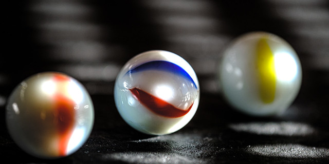 Marbles, with some color, sun and reflections
