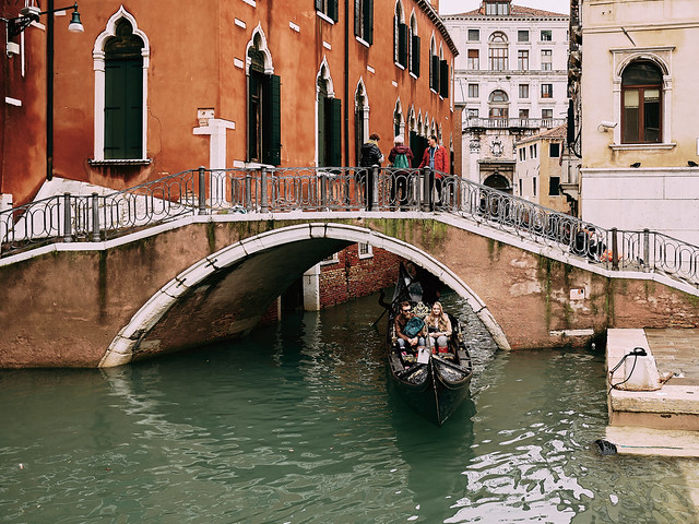 View of canal amidst buildings in city - [Venetian Streets]
