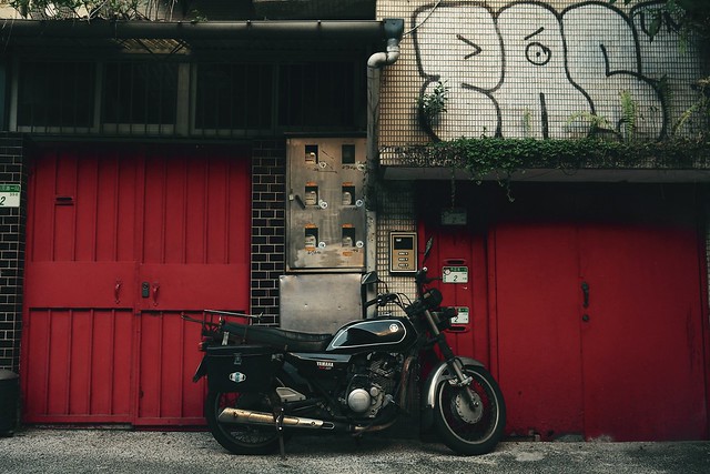 red doors and a motorcycle