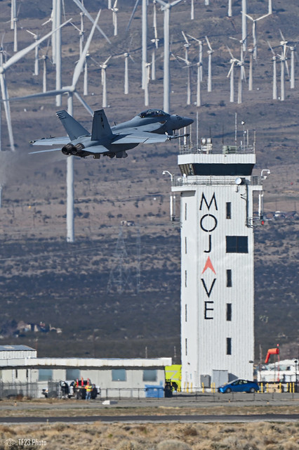 Top Gun Rhino passing by Mojave tower