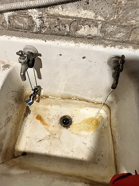 Diver tries to fix my 100-year old sink