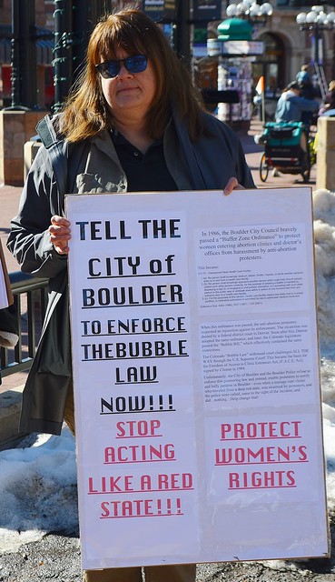 This woman calls on the City of Boulder (CO) to enforce a law restricting protests outside abortion clinics.