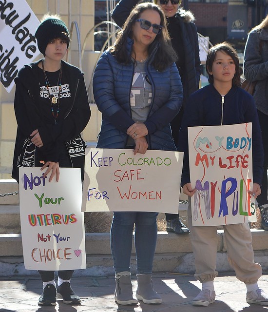 This mother and young children joined a rally for a ballot initiative to protect abortion rights.