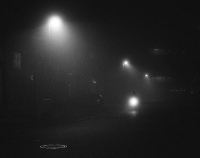 Lonely cyclist in the fog