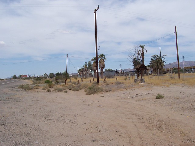 Essex, CA - looking east on Route 66. In the photo can be seen the old water well, former Caltrans maintenance yard and some of the remaining town buildings.   June 15, 2009