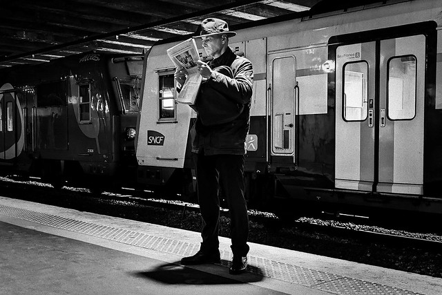 The man with a hat and a newspaper