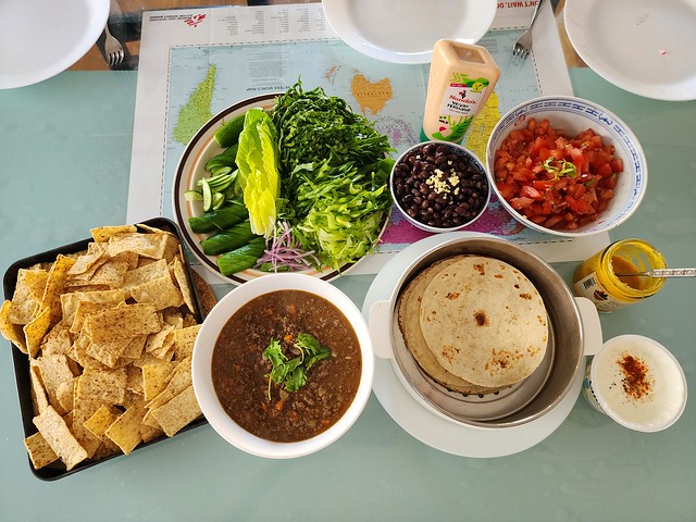 Julia's chilli beef tacos, black beans, tomato salsa, corn chips, Peruvian Aji Amarillo Sauce - S22