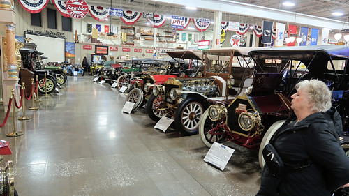 202401301455018 Barb by Row of Antique Automobiles - Stahls Auto Musuem                                