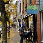 October 12, 2022: Autumn in the Market Street Historic District, Corning, New York Lively street life on an autumn afternoon in the Market Street Historic District of downtown Corning, New York.