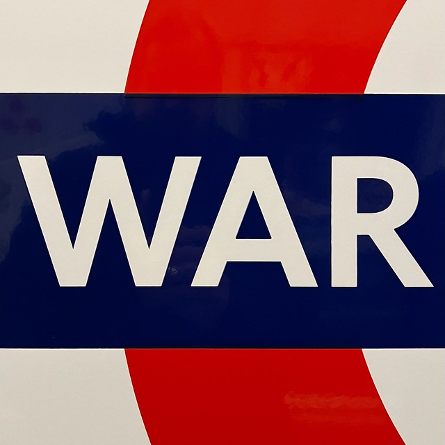 Close up of the Tube sign at Warren Street station showing just the letters W-A-R