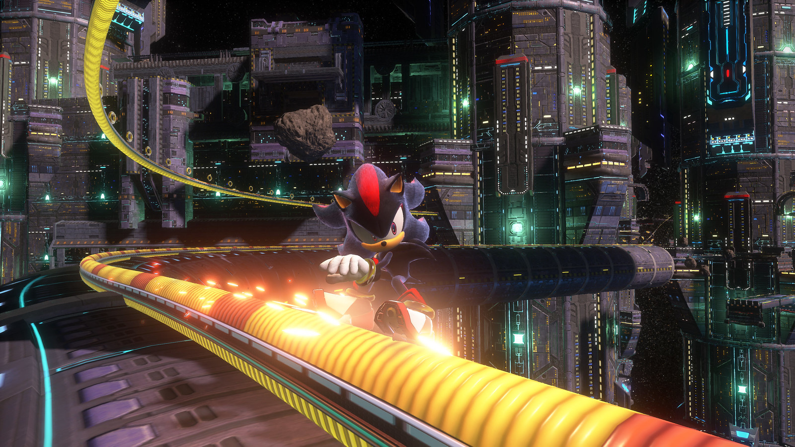 A lengthy yellow rail snakes through a sci-fi metropolis. Grinding along it towards the camera is Shadow the Hedgehog. 