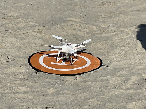Photo of a drone on a landing bad on a beach