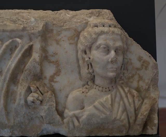 Fragment of a Roman strigillated sarcophagus with relief of the deceased woman, 2
