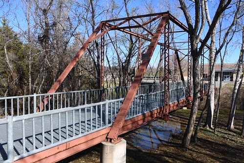 Old Rector Road Bridge (Denton, Texas) Historic Old Rector Road Bridge in Denton, Texas.  The Pratt through truss was built by the Austin Bridge Company in 1908.  It was originally located on Rector Road at Clear Creek near Sanger.  It was relocated for used as a pedestrian bridge at John Guyer High School in Denton in 2005.

The Old Rector Road Bridge was listed on the National Register of Historic Places in 2003 (NRHP No. 03001418).  The listing was updated in 2011 due to its the relocation.