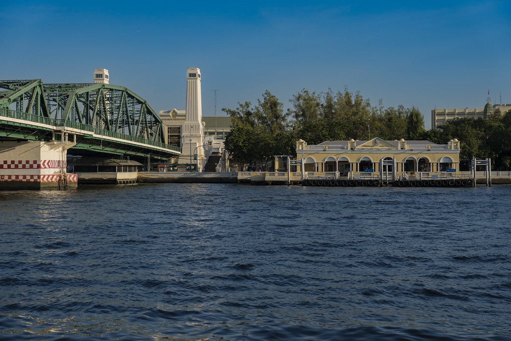 Memorial bridge with pier on the Chao Phraya river in Bangkok, Thailand