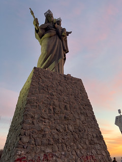 Lookin up at Virgen Maria Reina del Valle statue on top Cerro de la Memoria
