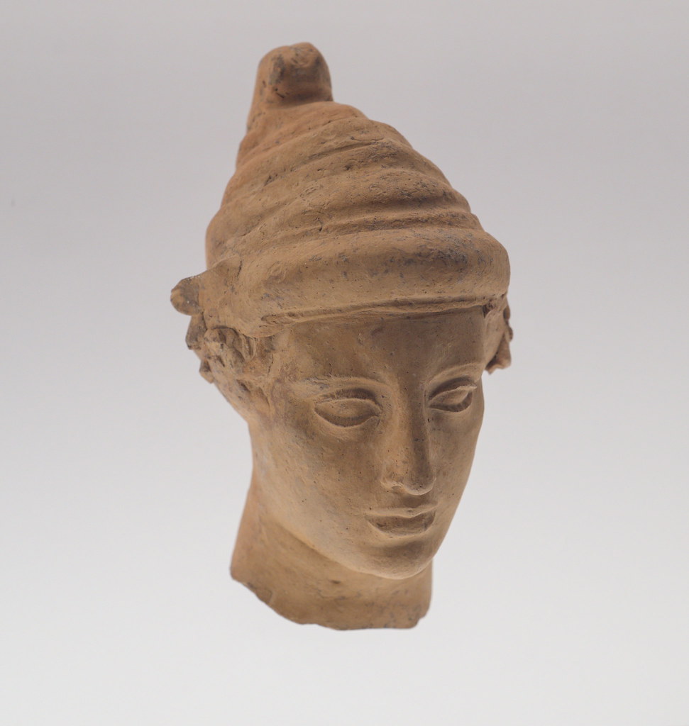 Tarentine terracotta head of a young man wearing a Phrygian cap (MANN 140903), 1