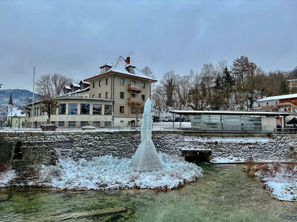 Frozen fountain next to Kieferbach creek in Kiefersfelden in Bavaria, Germany