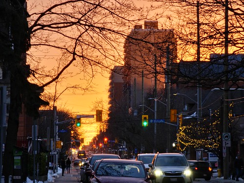 sunset towers building city cars traffic people trees branches orange samsung ottawa canada evening light snow winter trafficlights s23ultra samsungs23ultra