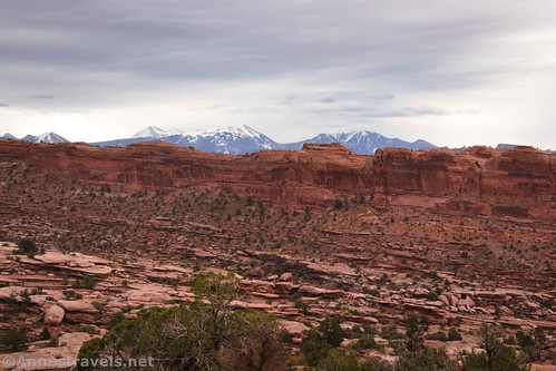 The La Sal Mountains far away across the slickrock ridge, Gold Bar Arch Trail Jeep Arch Trail, Moab, Utah