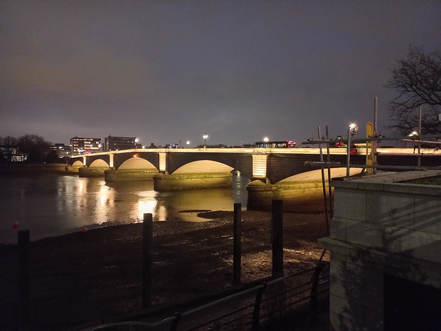 Putney Bridge at low tide after dark