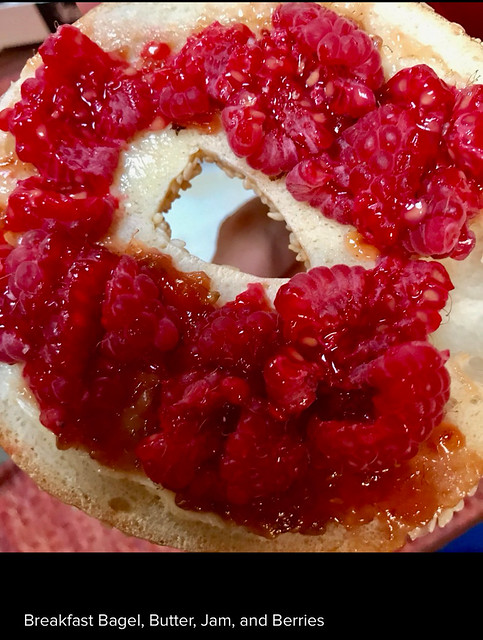 Toasted Bagel or Baguette, one-half, toasted and buttered:: Raspberry jam, 2 to 4 teaspoons:: Raspberries, enough to cover bagel. Mash the raspberries with a fork