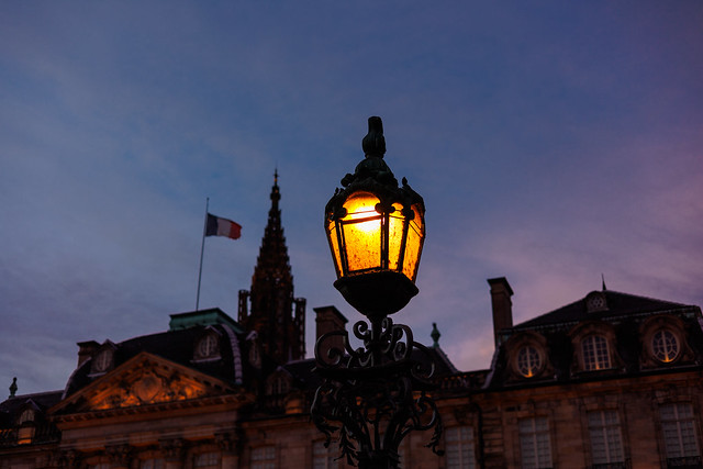 Street lamp with the Palais Rohan and Strasbourg Cathedral in the back