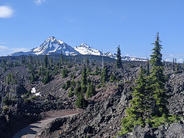 07519 North and Middle Sister in the distance over a lava flow on the Lava River Trail