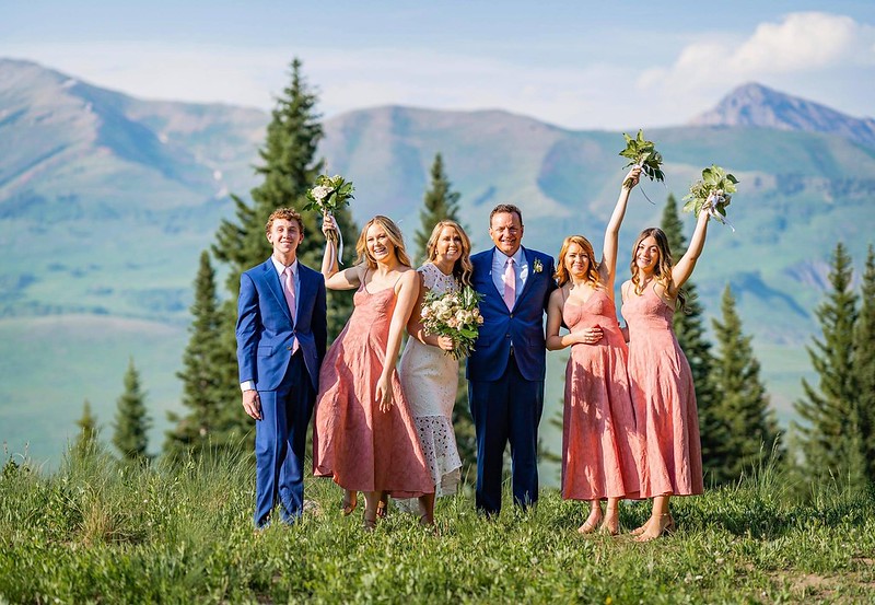 A family poses for a photo in the mountains of Colorado