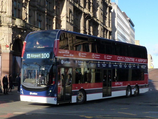 Lothian Buses Volvo B8L Alexander Dennis Enviro 400XLB SB19GLZ 1129 operating Airlink service 100 to the Airport turning from South St David Street to Princes Street on 7 February 2023.