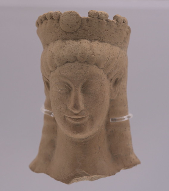 Miniature terracotta female head wearing a turreted diadem, from Locri (MANN 141024b)