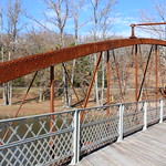 Springfield Bridge – Beaverfork Park (Faulkner County, Arkansas) Historic Springfield Bridge over Beaverfork Lake in Conway, Texas.  The bridge is a wrought iron bowstring arch truss.

The bridge was originally erected in 1874 by the King Bridge Company (King Iron Bridge &amp;amp; Manufacturing Company of Cleveland, Ohio) on the Springfield-Des Arc Road over North Cadron Creek.  It was relocated to Beaverfork Park in Conway in 1996 and has been preserved as a pedestrian bridge in Beaverfork Park.

Conway County, Arkansas awarded the King Bridge Company a contract for the bridge in 1871.  However, in 1873 the Arkansas Legislature divided Conway County creating Faulkner County with the creek as the new county line.  The bridge was installed in 1874 with Conway County and the new Faulkner County splitting the cost.

The Springfield Bridge was listed on the National Register of Historic Places in 1988 (NRHP No. 88000660).

Historic American Engineering Record (HAER-AR-32 as the Springfield-Des Arc Bridge)