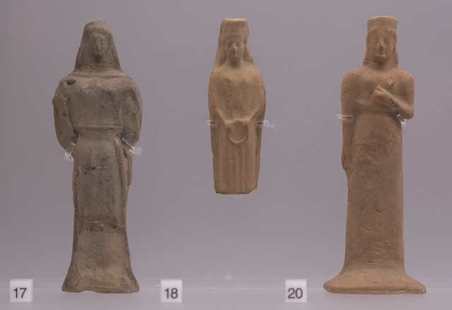 Three miniature terracotta standing female figures from Locri-Parapezza