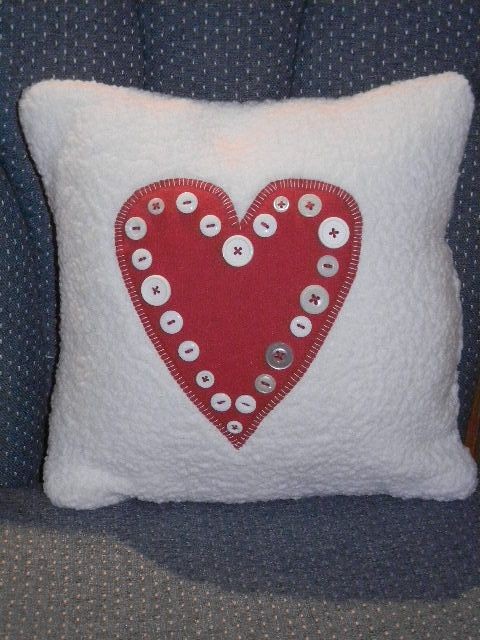 Valentine pillow I designed and appliqued a red wool heart with buttons on sherpa fabric