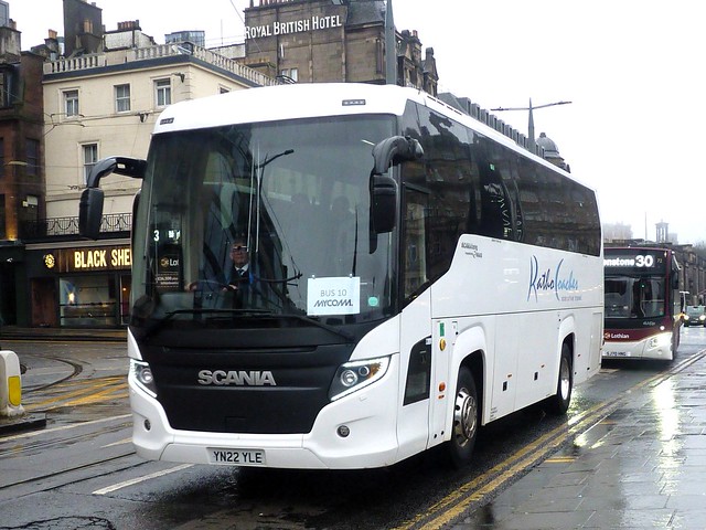 Ratho Coaches of Newbridge Scania K360IB4 Higer Touring YN22YLE at Princes Street, Edinburgh, on 10 February 2024.