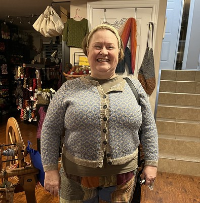 Paulette (@psknitting50) came to Spin Night wearing her 1713-01 Blomsterjackke / Flower Cardigan by Sandnes Garn knit using Sandnes Garn Sisu.