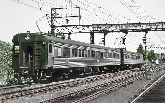 Penn Central operated former New Haven Railroad Pullman-Standard stainless steel (aka; Washboard) MU coaches are seen west Stamford on the electrified main line at Mamaroneck, New York, 1969