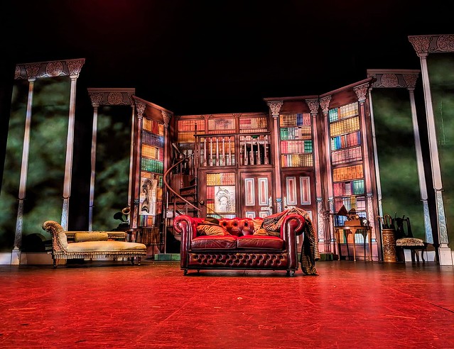 Red-lit stage, on set of My Fair Lady at Mercury Theatre, Colchester