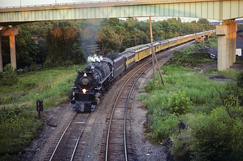 6/27/81, Ex. C&O 4-8-4 614 The Chessie Safety Express rolls under the US 62 expressway in Youngstown on its way back to Akron, OH.