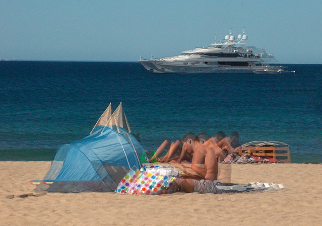 Reflection in Double-glazed Window of People Relaxing on Kontiki Beach St. Tropez - South of France