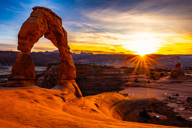 Sun setting on Delicate Arch. Arches National Park, Utah