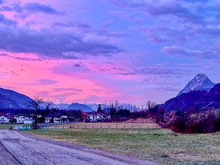 Pink and purple winter dawn over Kiefersfelden in the river Inn valley with Pendling mountain and the Alps in Bavaria, Germany