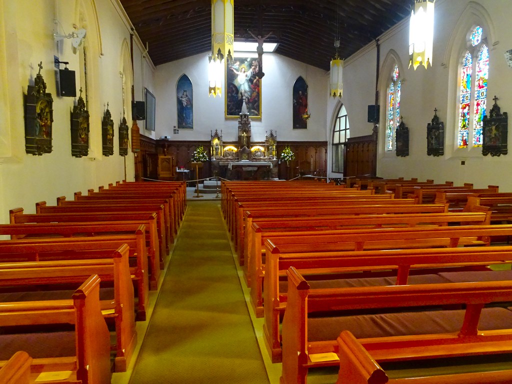 Hobart, The interior of the convict built 1841 Catholic Church. Some stained glass windows installed 1856. Resurrection painting above altar done 1838 installed 1841. Oldest Catholic Ch in Hobart.