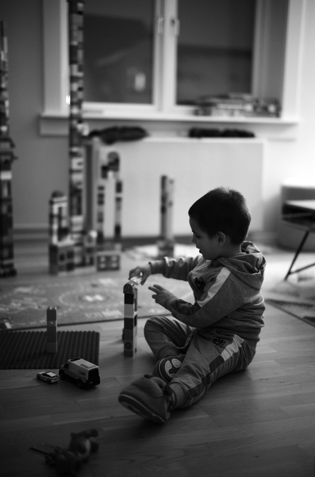 Young boy plays with Lego Duplo