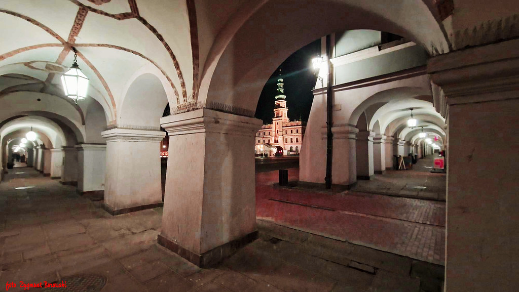 Zamość - The arcades of tenement houses and the town hall at night